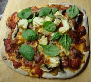 Homemade pizza with fresh basil