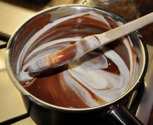 Egg white being folded into chocolate mixture