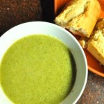 Bowl of homemade broccoli soup and fresh bread