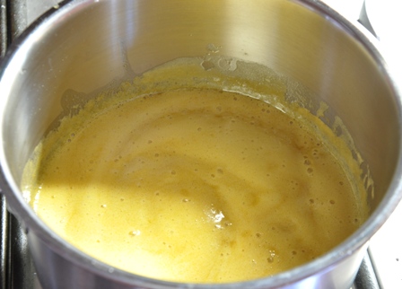 An image of butter and syrup melting in a pan
