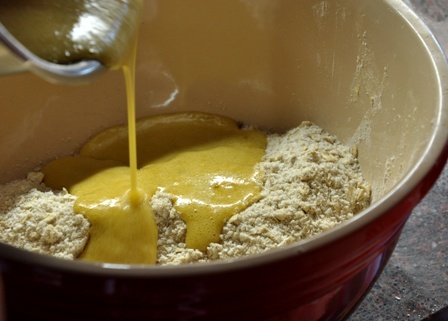An butter and syrup being poured for ANZAC biscuits