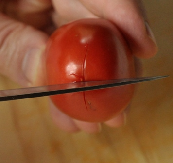 cutting tomato skin for blanching