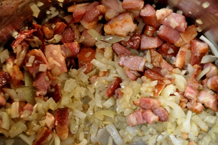An image of bacon and onion frying