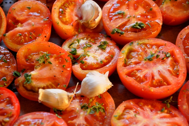 Seasoned tomatoes ready for roasting