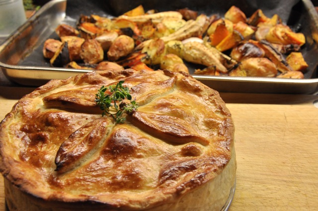 An image of rabbit and prune pie with roast veg