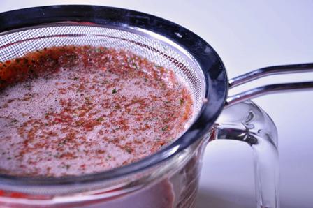 An image of Pimms sorbet mix being strained