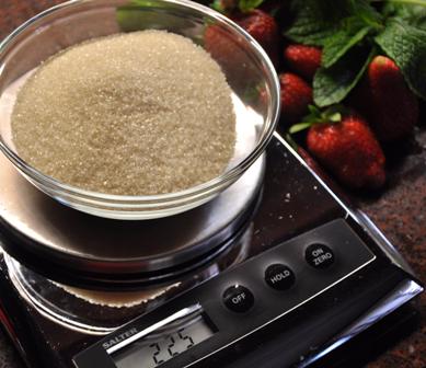 AN image of raw cane sugar on scales.