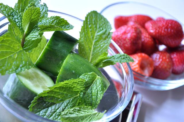 An image of cucumber, fresh mint and strawberries.