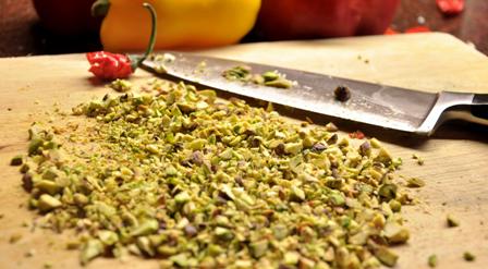 An image of chopped pistachio nuts for stuffed peppers