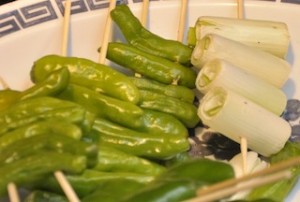 An image of Yakitori leeks and peppers on skewers