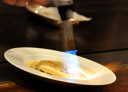 An image of steamed John Dory under a blow torch.