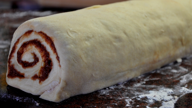 An image of cinnamon roll dough ready for baking
