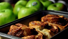 An image of cinnamon and apple rolls with granny smith apples