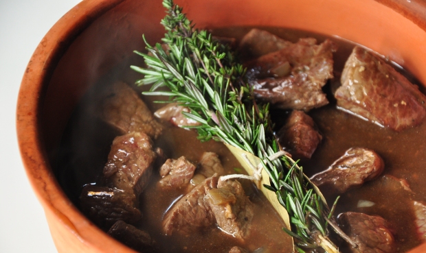 An image of beef stew with a bouquet garni