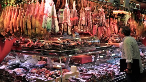 An image of a charcuterie stand at La Boqueria