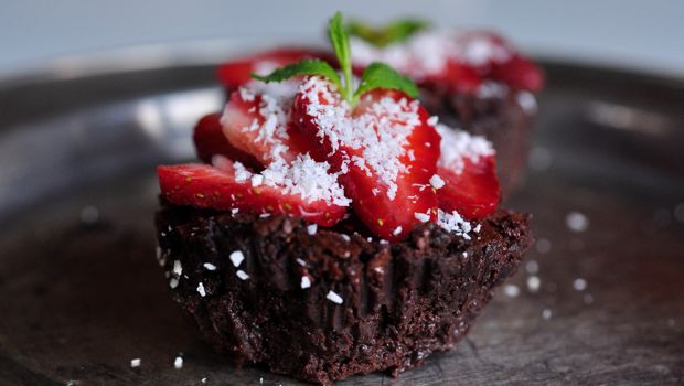 An image of chocolate mousse cup cakes on plate without case