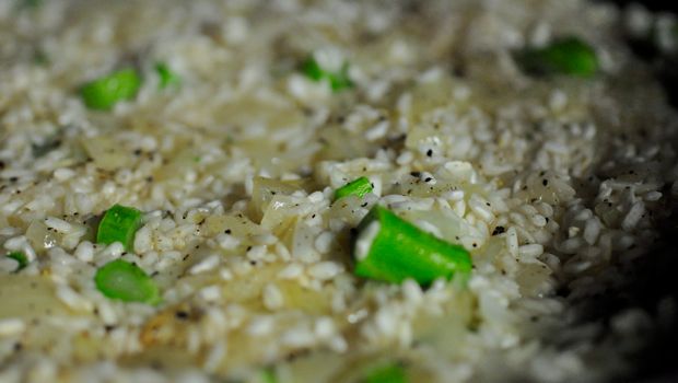 An image of risotto with chopped broccolini