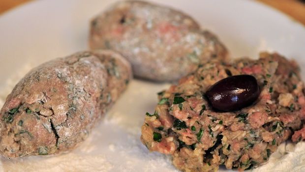 An image of Greek meatballs being shaped