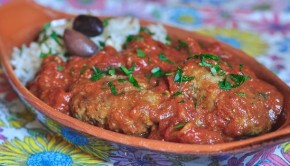 An image of Soutsoukakia - Greek meatballs with rice and tomato sauce