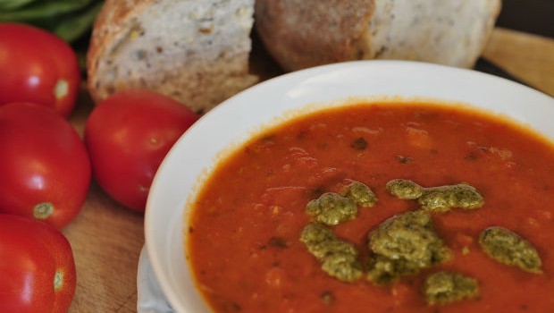 Roast pepper and tomato soup close up in a bowl