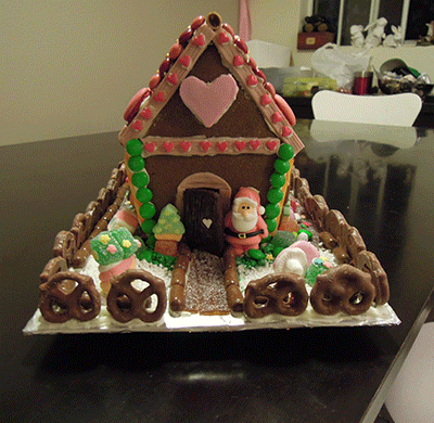 An animation of gingerbread house pictures featuring each angle