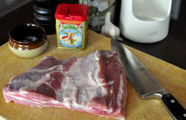 Pork belly for chorizo on a chopping board