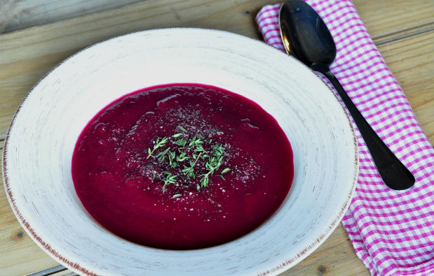 Roasted beetroot soup on a wooden table