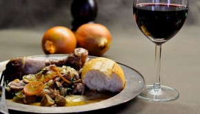 Coq au Vin with a glass of red wine